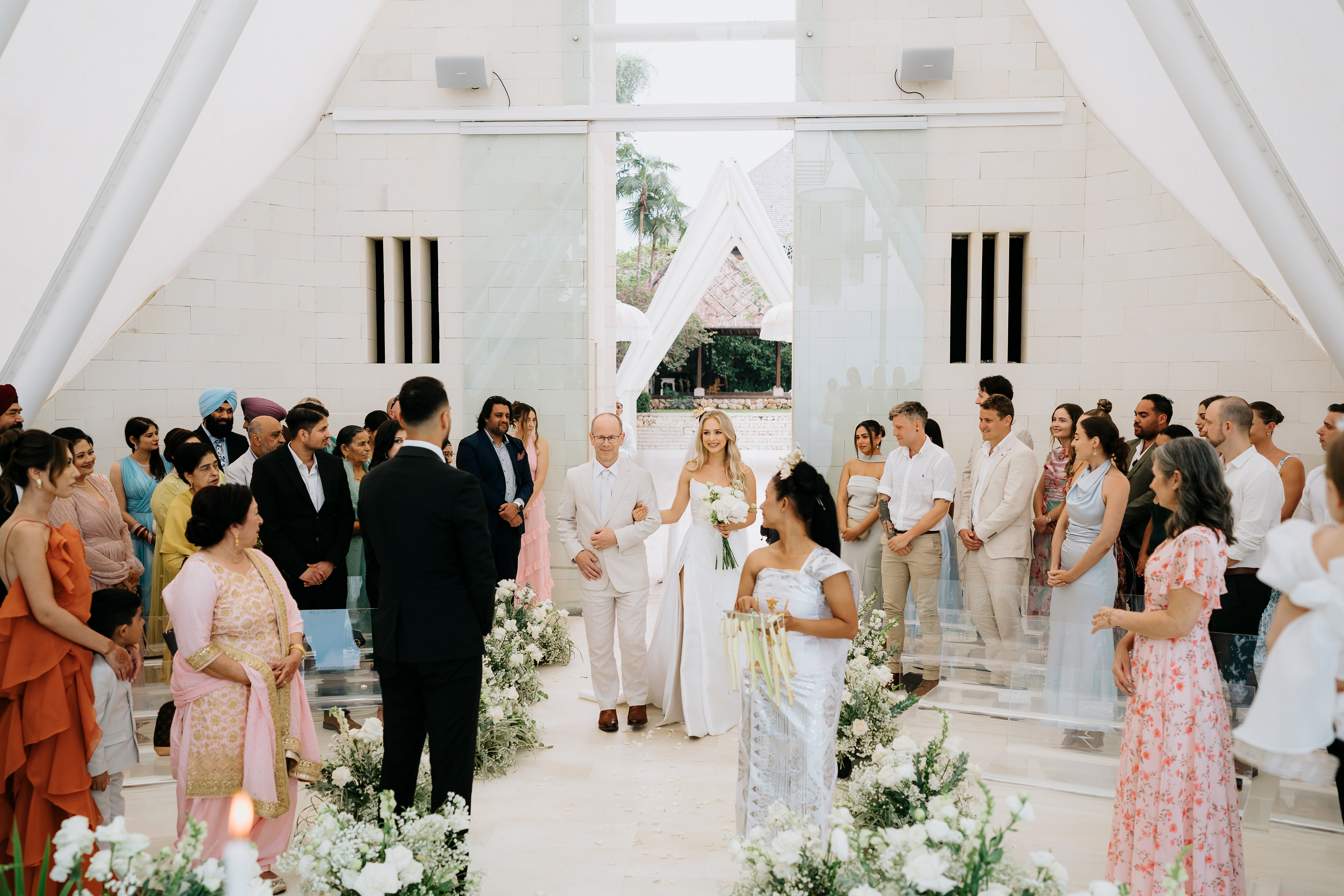 bride walking down aisle with dad at tirtha bali
