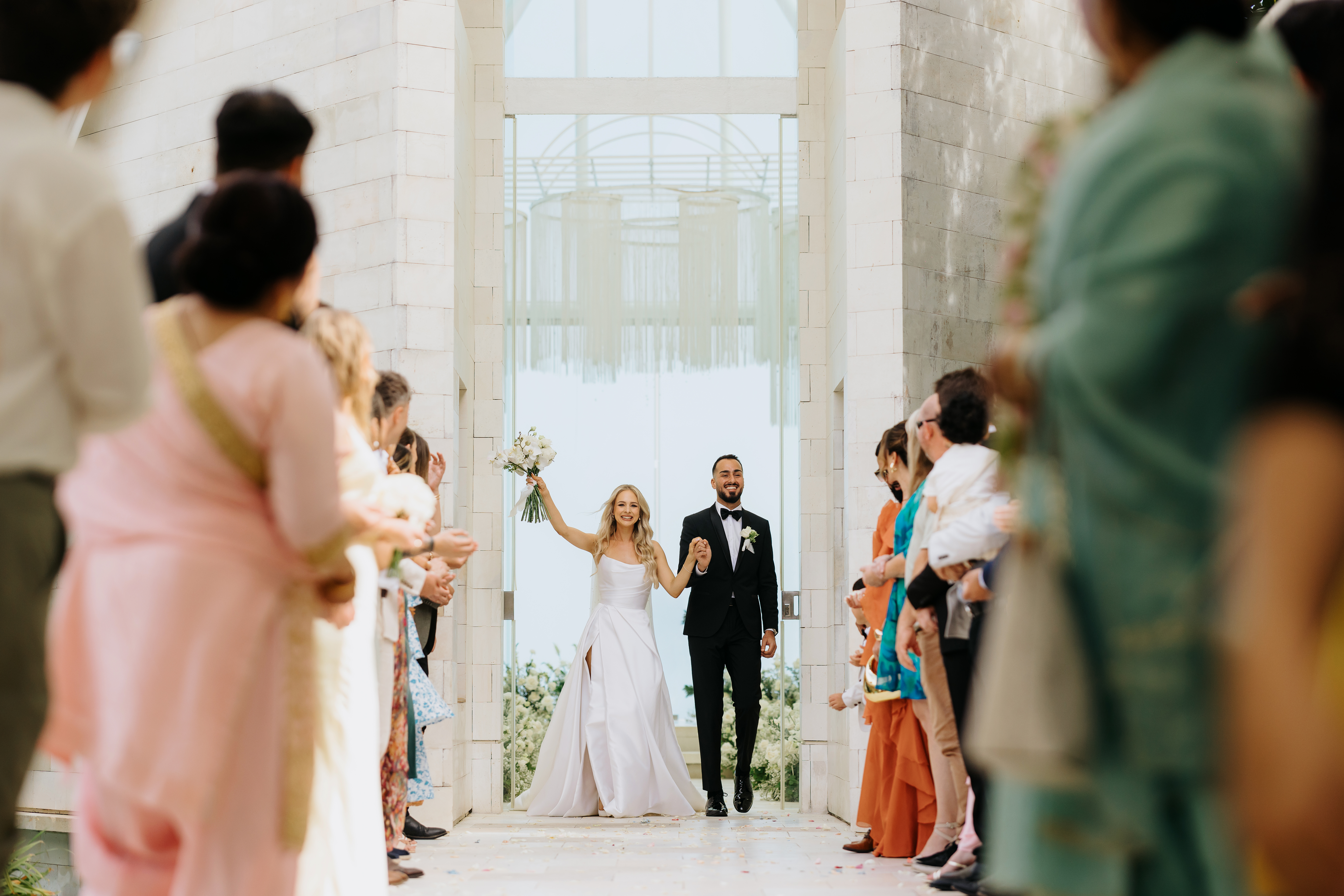 couple walking into wedding venue