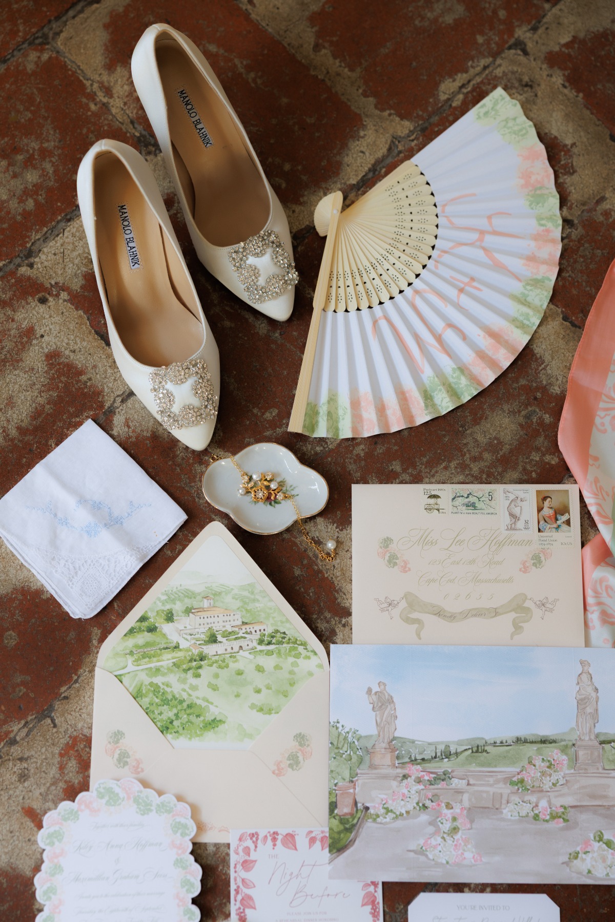 wedding flatlay with bridal accessories along with the invitation suite