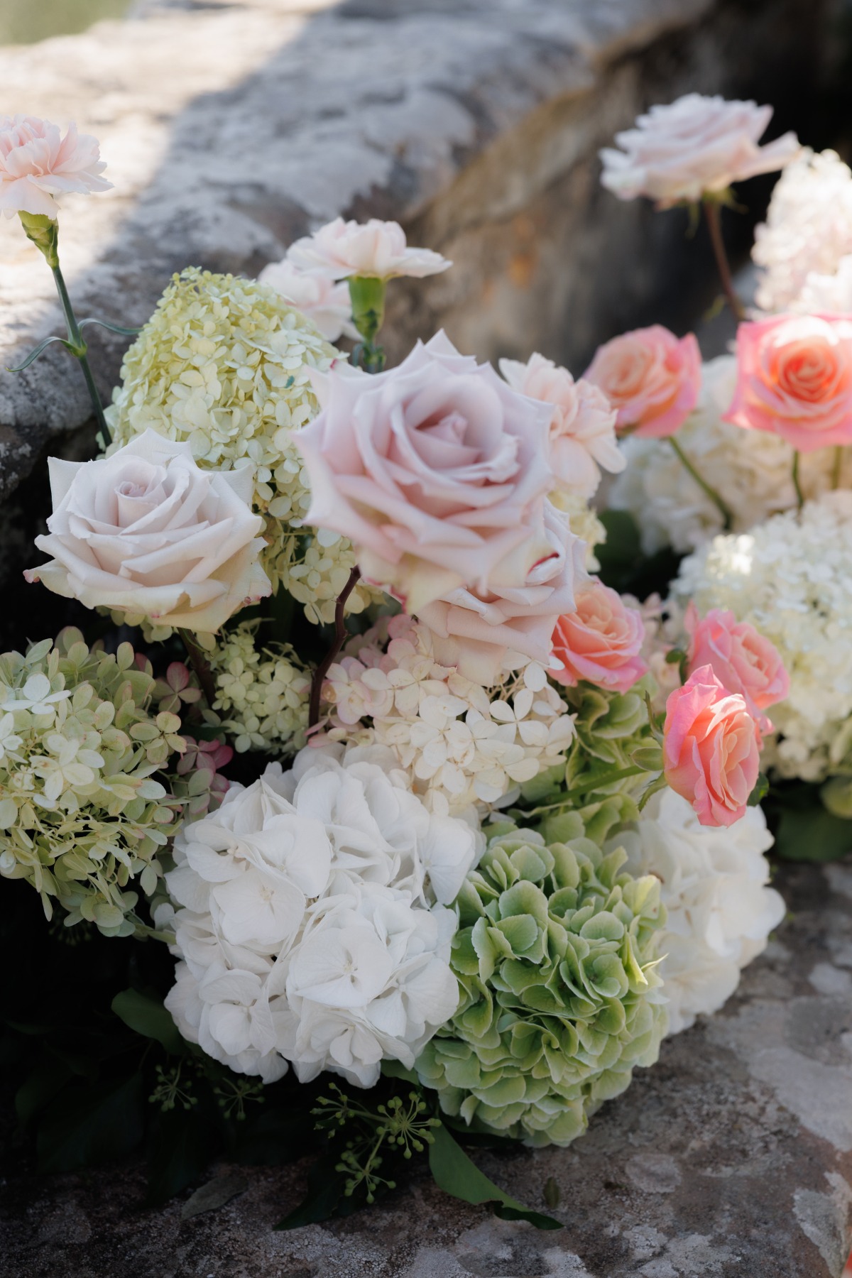 wedding florals mixed with lavender roses, hot pink garden roses and green and white hydrangeas
