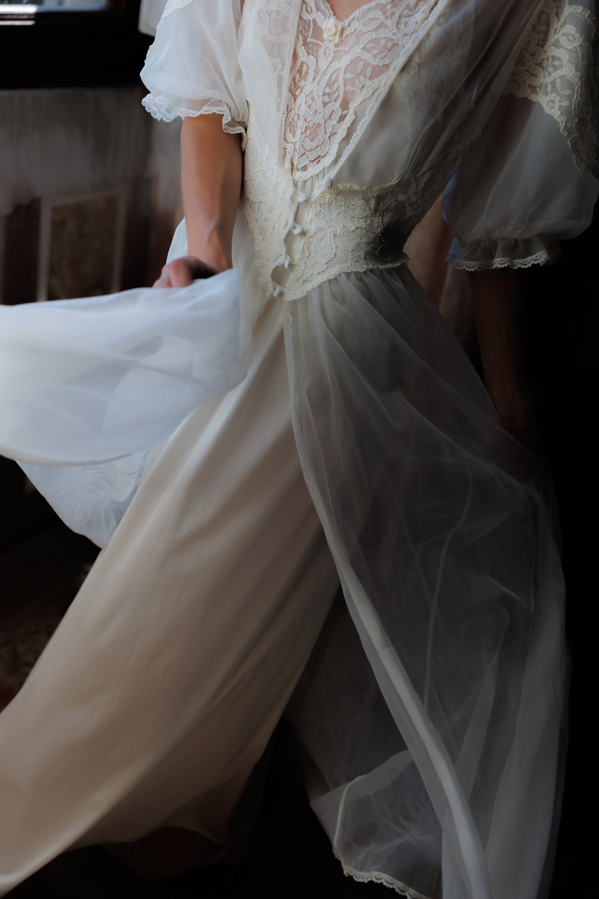 bride spinning in vintage wedding dress