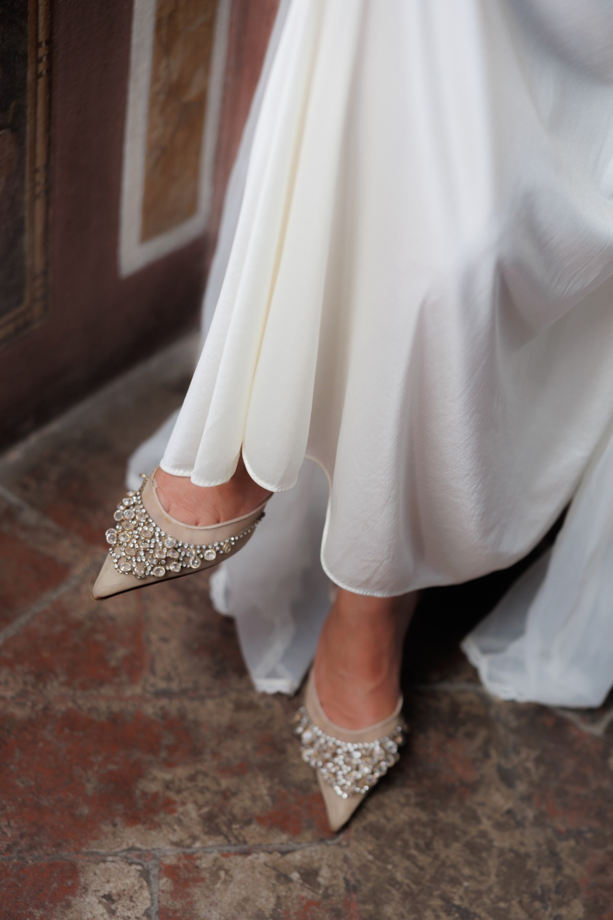 shot of bride's heels which are jeweled and beaded