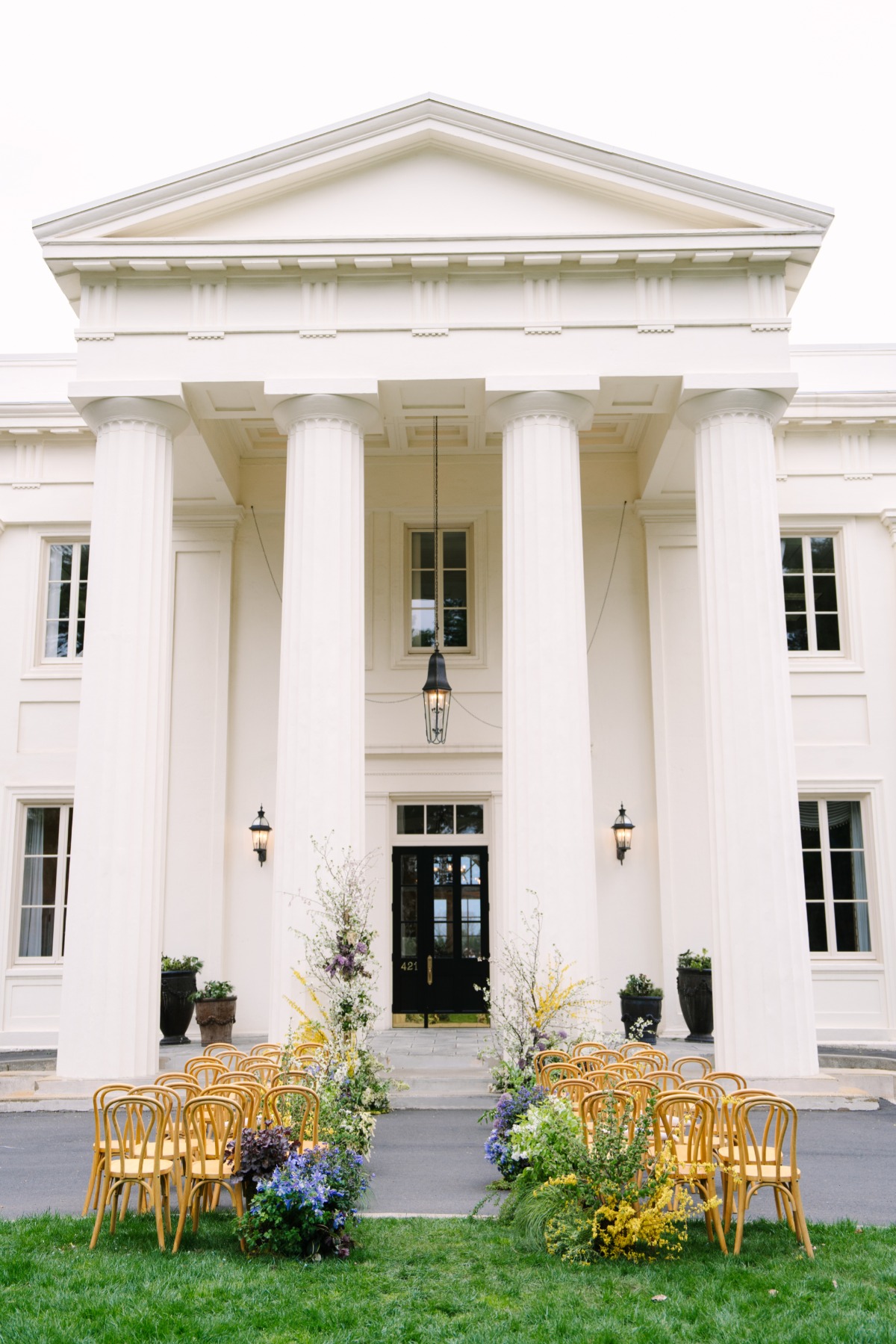 wedding venue ceremony set up with big pilars and florals
