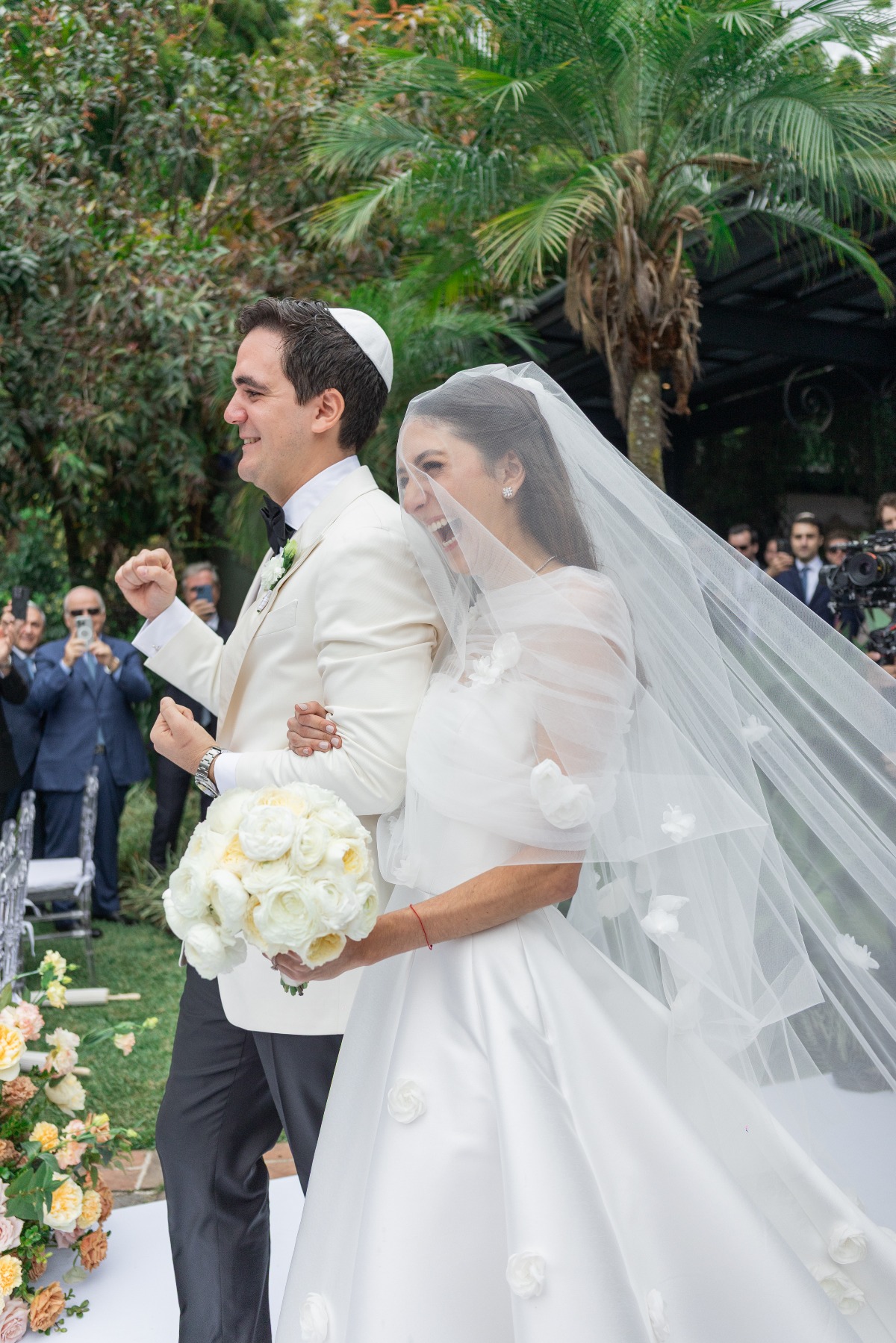 couple walking down aisle very happy