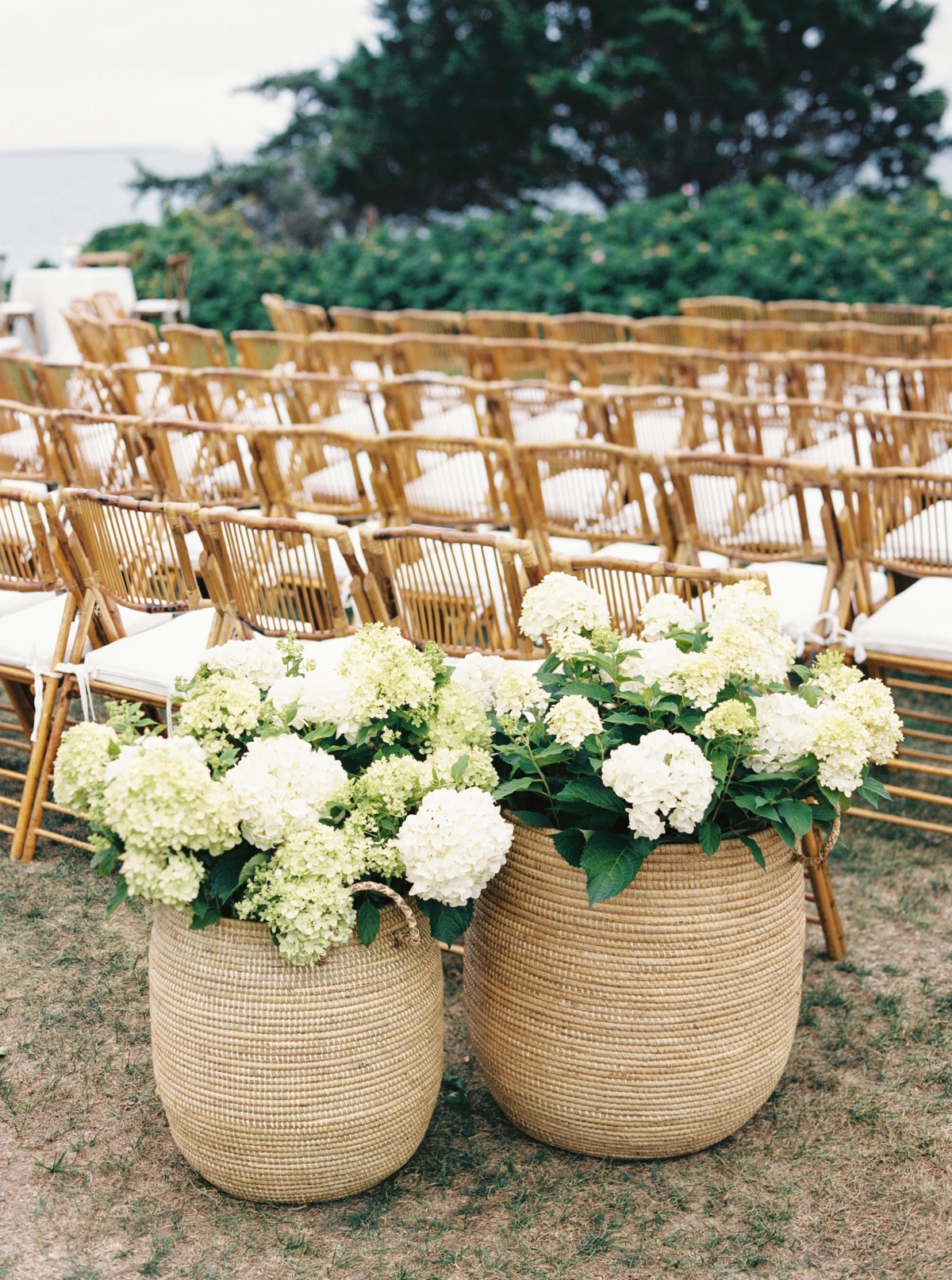 wedding ceremony set up with wooden tropical chairs
