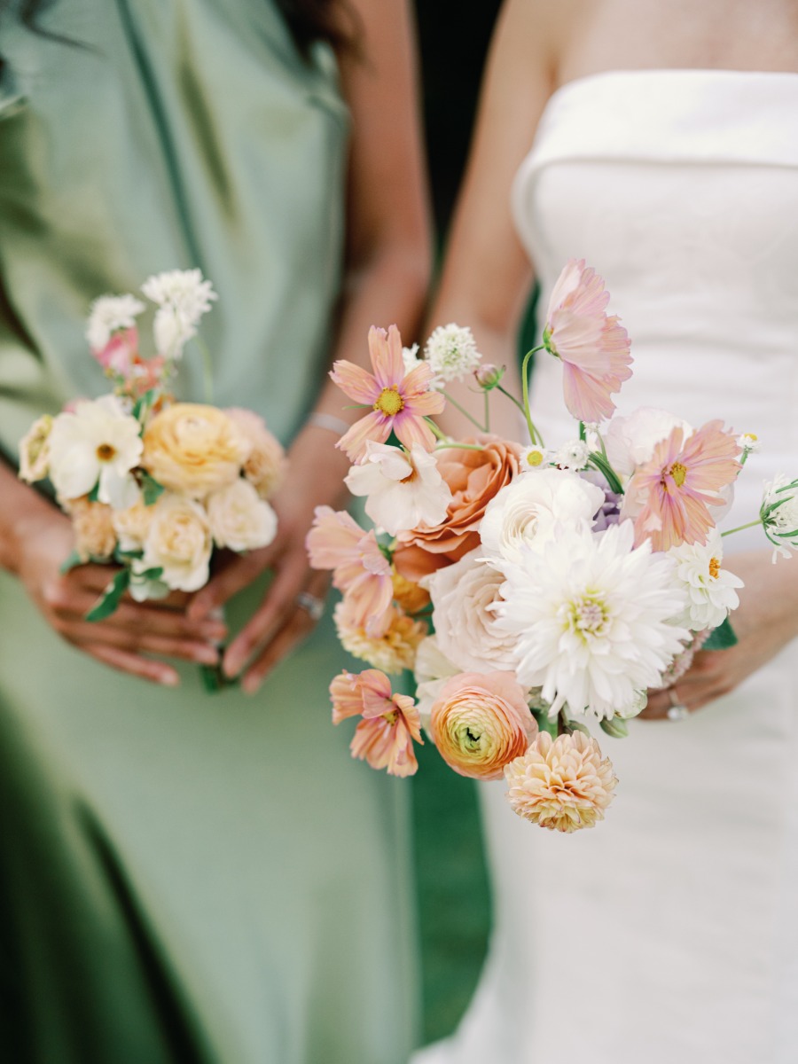 Bridesmaids holding little pastel bouquets