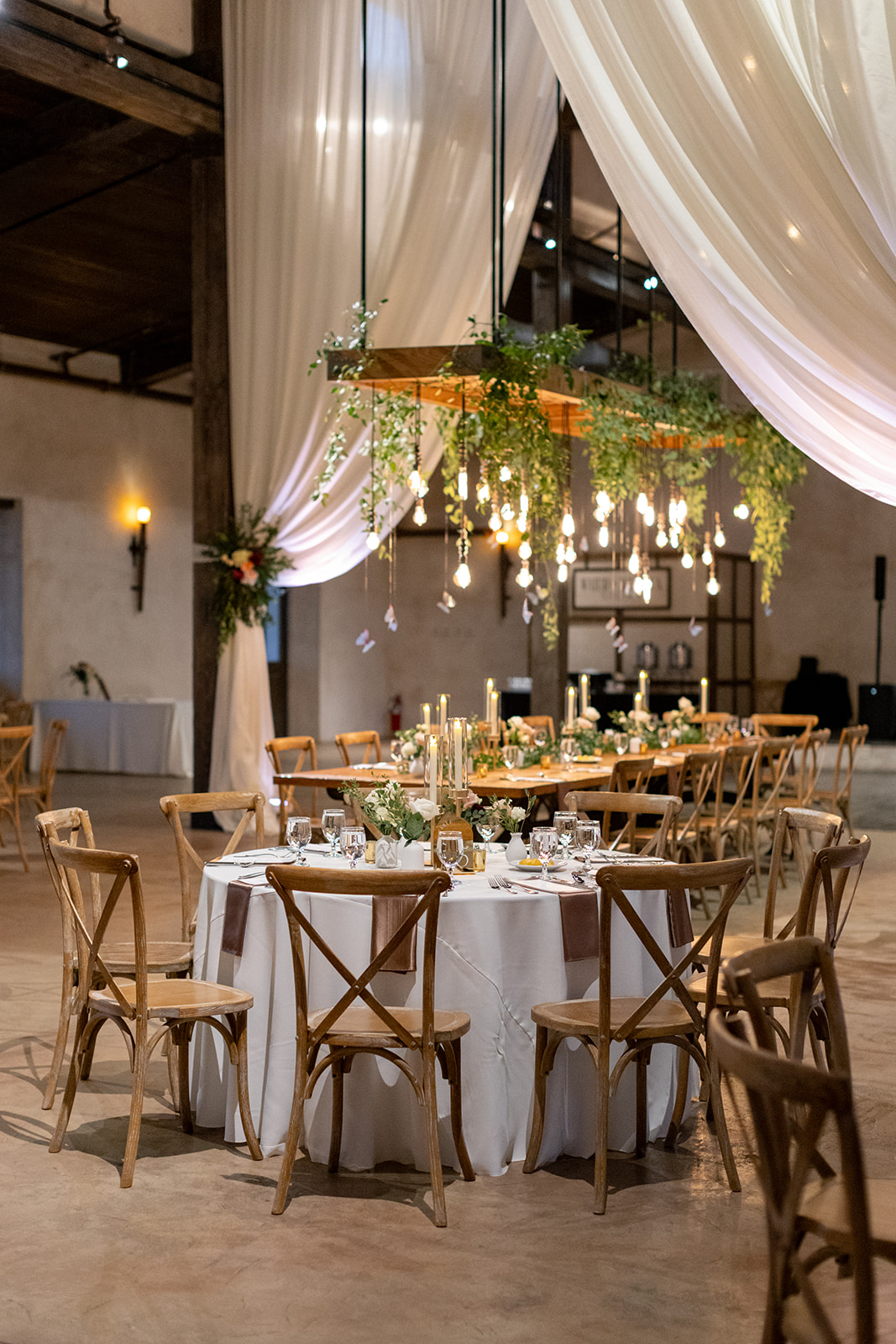 greenery hanging installation with butterfly details